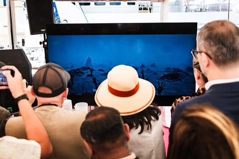 Guests watch the Hell Grind trailer